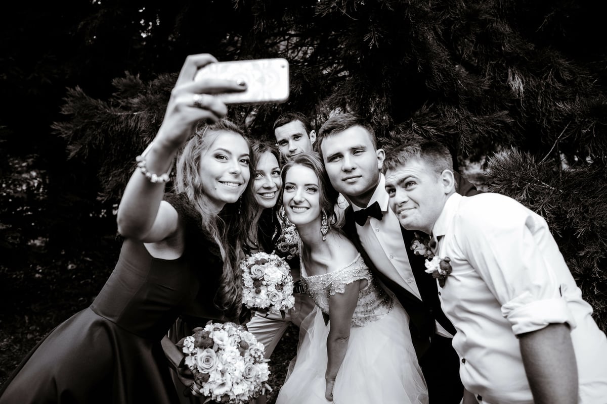 wedding-group-recording-a-video-message-on-their-phone